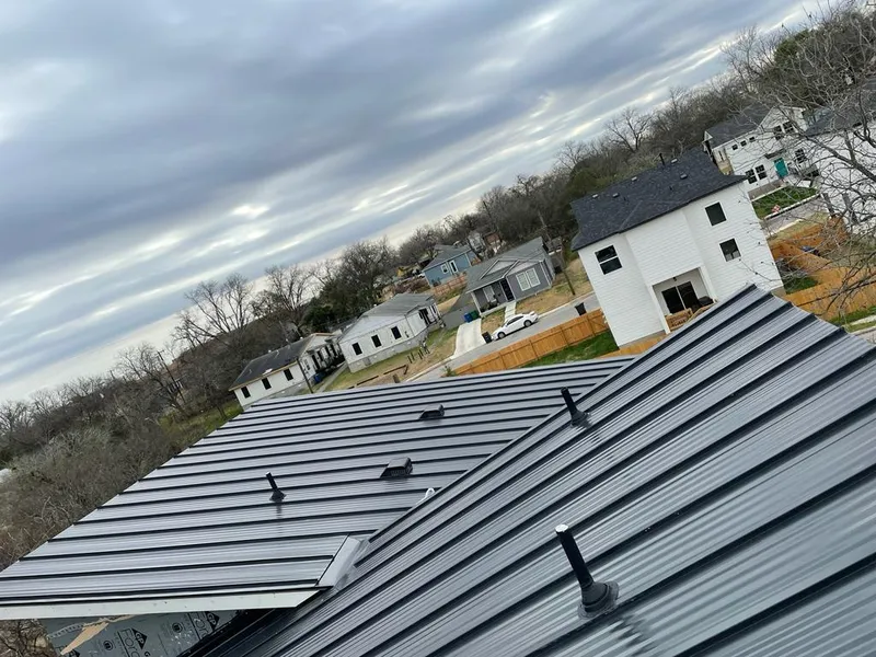 Standing seam metal roof panels with vents for Skylight Repair in Barre